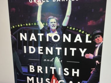 How do musicals symbolize our national identity?